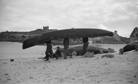 Inishere, people carrying a boat